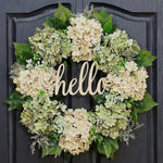 Green hydrangea crown with "Hello" sign